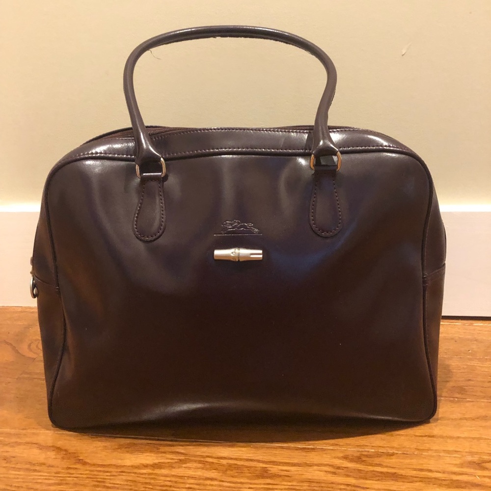 Longchamp burgundy pocketbook.